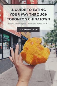 a person holding up a piece of food with the words, a guide to eating your way through toronto's chinatown