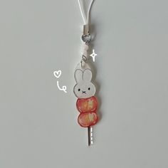 this is a handdrawn bunny tanghulu phone charm <3 it includes pretty milky-colored beads, and a handdrawn bunny tanghulu charm! perfect for anyone who loves nijntje or for someone with a coquette style !! since this nijntje is completely handdrawn, please excuse some slight colorbleeding! Miffy Bracelet, Miffy Charm, Shrinky Dink, Coquette Style, Phone Charm, Wedding Shop, Gift Registry, Keychains, How To Draw Hands