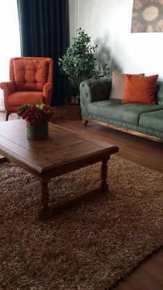 a living room with two couches and a coffee table in front of a window