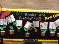 a bulletin board with flowers and books on it that says our books are blooming pick one