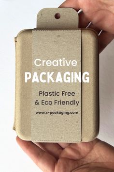 a person holding a package in their hand with the text creative packaging on it's side