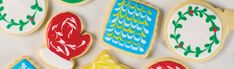 decorated cookies are arranged on a table