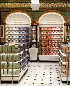 the interior of a cosmetics store with lots of products on shelves and tiled flooring