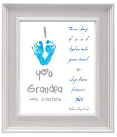 a frame with a baby's hand and foot print in pink, grey and white