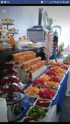 a buffet table filled with lots of different types of food and drinks on it's sides