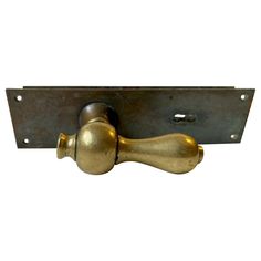 an old brass door handle on a white background