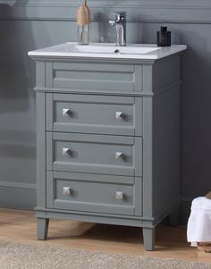 a bathroom vanity with drawers and a sink