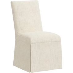 a white chair that is upholstered with fabric