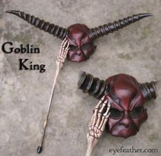 two skulls with long horns on their heads are shown next to each other and the words goblin king above them