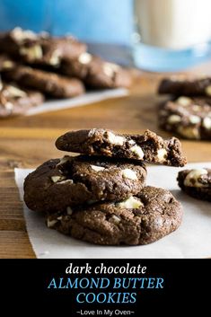 chocolate cookies are stacked on top of each other with white chocolate chips and marshmallows