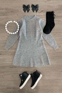 Dress features a heather gray design with cable knit detailing Long sleeve design makes it easy to layer & perfect for colder weather Ultra-soft material for comfort & ease Pull-over style for easy dressing Add sweet fluttery style to her look with this Gray Knit Sweater Dress. This girls' dress is styled with a simple high neckline and long sleeves, making it a staple addition to her everyday wear. The knit fabric makes for comfy wear, while the pull-over style allows for simple dressing. She c Grey Sweater Outfit, Gray Knit Sweater, Simple Dressing, Comfy Wear, Family Picture Outfits, Long Sleeve Design, Grey Sweater Dress, Family Picture, Grey Knit Sweater