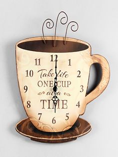 a clock that is sitting on top of a cup