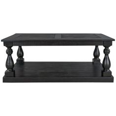 a black coffee table with two wooden legs