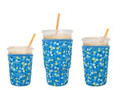 three cups with straws in them sitting next to each other