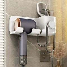 there is a hair dryer on the wall