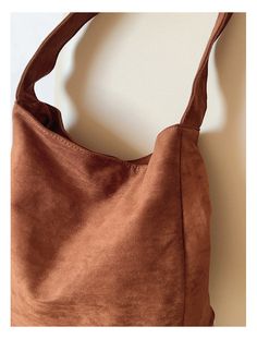 Carry your essentials in style with the Elena Handbags Soft Suede Shoulder Bag. Made of luxurious suede, this bag is both soft and durable. With its roomy interior and adjustable strap, it's perfect for everyday use. Upgrade your handbag game with Elena Handbags. Material: High Quality Suede PU Leather Size approximately 14.5"H x 13.7"W x 4.7"D Designer Style ID: 8786 Designer Style, Winter Sale, Soft Suede, Pu Leather, Adjustable Straps, Shoulder Bag, Handbags, High Quality, Leather