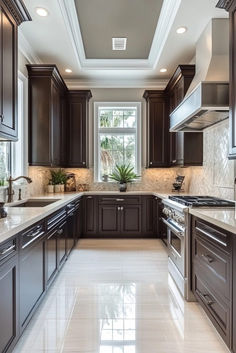 a large kitchen with brown cabinets and marble counter tops