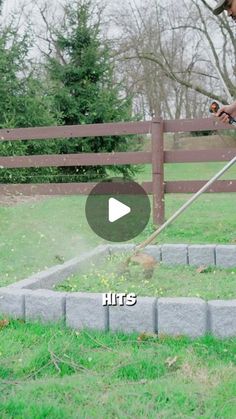 a man is using a lawn mower to trim the grass in his yard with words that read hits