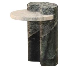 a marble side table with two sections on each end and one section at the top