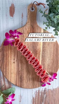 a cutting board with flowers on it and a sign that reads,'floral savannah river '