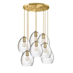 six clear glass globes hanging from a brass ceiling fixture