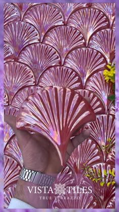 the back side of a woman's head in front of purple background with flowers