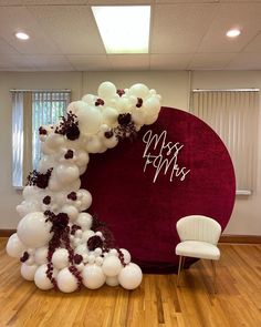 balloons and flowers decorate the entrance to an event