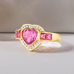 Ross-Simons - 3.20ct t. w. Pink Topaz, .18ct t. w. Diamond Heart Ring Over Sterling. Size 8. Stand out on date night with our glitzy ring! It flaunts a radiant 2.00 carat heart-shaped pink topaz accentuated by a sparkly halo of .18 ct. t. w. round diamonds and additional 1.20 ct. t. w. square pink topaz gems trailing either side. Crafted in 18kt yellow gold over sterling silver. 1/2" wide. Diamond and pink topaz heart ring. Luxury Diamond Ring Vs Clarity For Valentine's Day, Luxury Heart Cut Diamond Ring For Valentine's Day, Cubic Zirconia Diamond Ring For Valentine's Day, Luxury Pink Heart Ring For Anniversary, Valentine's Day Wedding Birthstone Ring With Diamond Accents, Luxury Diamond Ring With Gemstone For Valentine's Day, Dazzling Brilliant Cut Ring For Valentine's Day, Valentine's Day Diamond Ring With Center Stone, Round Cut, Mother's Day Heart Cut Cubic Zirconia Heart Ring