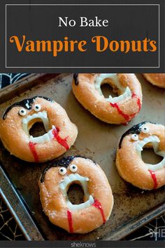 there are four donuts that have been decorated to look like vampire mouths and teeth