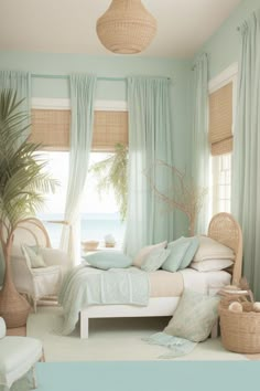 a bedroom with blue walls and green curtains on the windowsills is decorated in wicker furniture