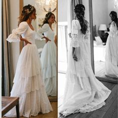 two women in wedding dresses looking at themselves in the mirror and one wearing a dress with ruffles on it