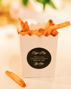 a small white box filled with french fries