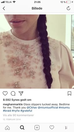 a woman with long braids on her head is looking at the camera and has an instagram