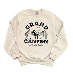 Looking for a cute versatile top to wear this summer? Make sure to grab one of our Vintage Grand Canyon National Park Sweatshirts! This soft and comfortable shirt is the perfect top for any outfit. It can be paired with biker shorts, Jeans, or the classic stay at home sweats! The bright color adds a pop of summer to any outfit. This sweatshirt is true-to-size, so be sure to order your regular size! If you are looking for a more oversized look, make sure to size up. Spring Crew Neck Tops For Outdoor Activities, Crew Neck Tops For Outdoor Activities In Spring, Comfortable Crew Tops With Letter Print, Comfortable-fit Letter Print Crew Tops, Graphic Print Crew Neck Tops For Outdoor Activities, Graphic Print Crew Tops, Relaxed Fit Tops With Letter Print For Outdoor Activities, Relaxed Fit Text Print Top For Outdoor Activities, Relaxed Fit Cotton Sweatshirt For Outdoor Activities