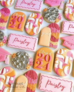 decorated cookies with pink and orange designs for a 30th birthday party or bridals