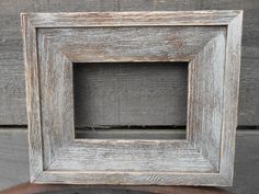 an old wooden frame sitting on top of a table