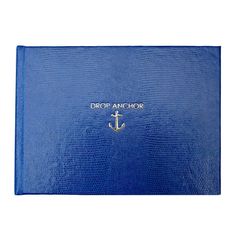 a blue book with an anchor on the front and gold lettering that reads drop anchor