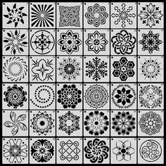 an assortment of black and white flower designs on squares, each with different shapes in the center