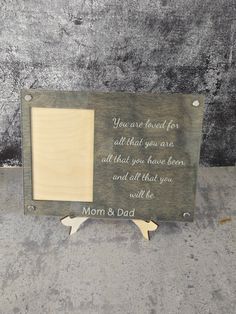 a wooden frame with a quote on it