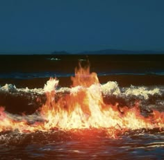 a fire hydrant spewing out flames into the ocean