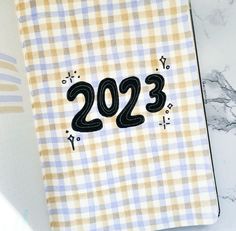 a notebook with the number 2093 printed on it