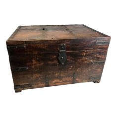 an old wooden chest with metal handles