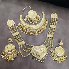 This Is Beautiful Indian Punjabi Gold Jadau  Hasli Necklace With  Raniharr Earings For Women ANd Girls / Punjabi Jadau Combo Set With Neckline Passa Tikka Hairpin Combo Set /Indian Wedding Set / Punjabi Wedding Set / Jadau Jewelery / Jadau Necklace / Gold Jewellery / Sangeet Jewellery / Baraat Jewellery / Jaggo Set / Mangtikka Set/ Passa Tikka / MADE WITH REAL NAVRATAN JADAU , Gold And Pearls. For any Query DM ME. thank You :) Jaggo Jewelry, Sangeet Jewellery, Hasli Necklace, Jadau Necklace, Punjabi Wedding, Jewellery Ideas, Wedding Set, Gold Set, Gold Jewellery