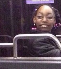 a woman sitting in the passenger seat of a bus