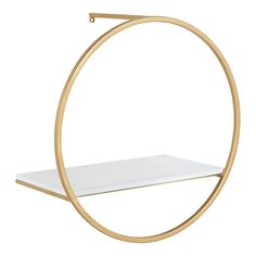 a gold and white shelf with a circular design