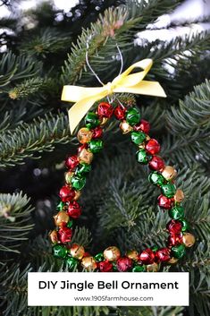 a christmas ornament hanging from a tree with the words diy jingle bell ornaments