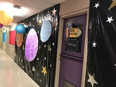 a hallway decorated with paper lanterns and stars