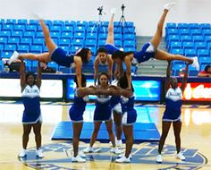 the cheerleaders are doing tricks on the court