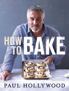 the book cover for how to bake by paul hollywood, with an image of a man holding a tray of doughnuts