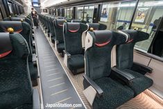 an empty train car with many seats on it